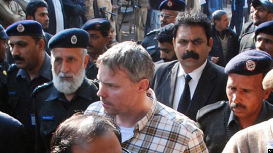 Pakistani police escort arrested US national, identified as Raymond Davis (C), to a court in Lahore (File Photo - January 28, 2011)