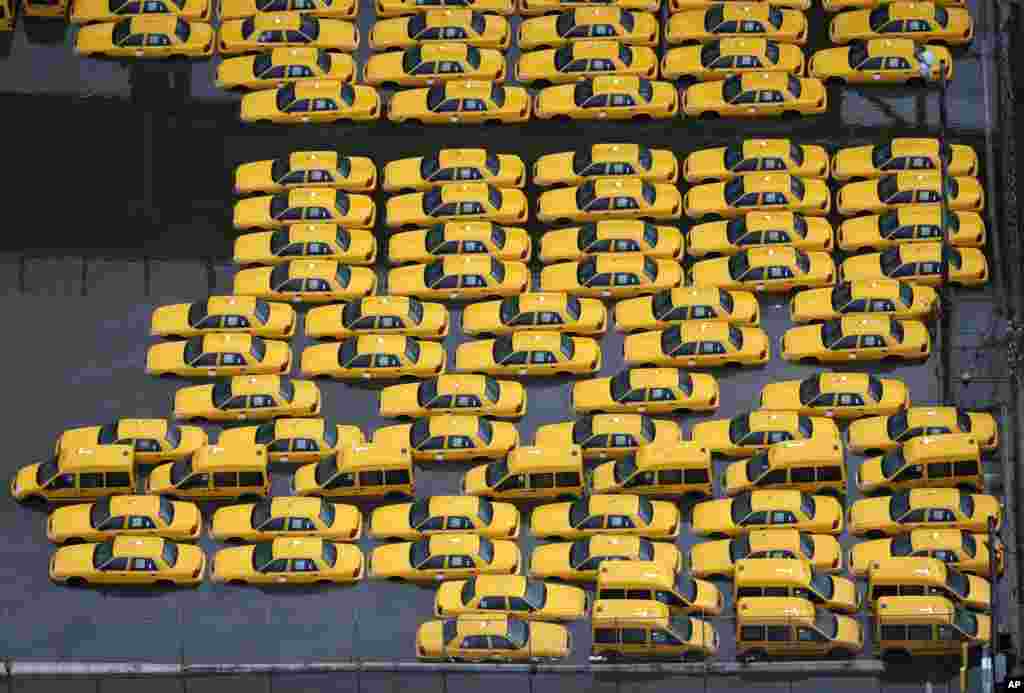 Taxis are submerged in floodwaters in the wake of superstorm Sandy on Oct. 30, 2012, in Weehawken, N.J.