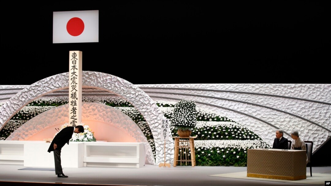 Japan's Prime Minister Shinzo Abe, left, bows to Emperor Akihito and Empress Michiko during the national memorial service for the victims of the March 11, 2011 earthquake and tsunami, in Tokyo Wednesday, March 11, 2015.