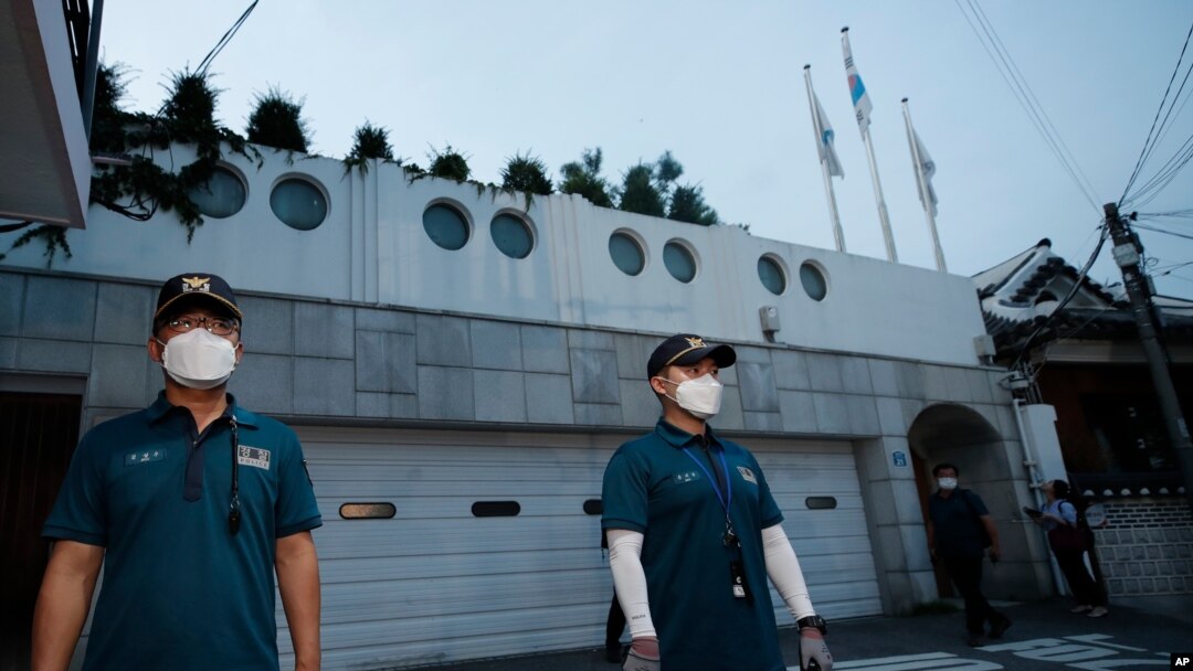 Police officers stand guard in front of the official residence of Seoul Mayor Park Won-soon in Seoul, South Korea, July 9, 2020. Police say Park has been reported missing and search operations are underway.