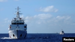 中國海警船在南中國海追趕越南海警船（路透社資料圖）