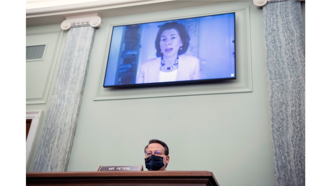 Sen. Gary Peters, D-Mich., questions nominee for Secretary of Commerce, Gina Raimondo, during her Senate Commerce, Science, and Transportation Committee confirmation hearing, Jan. 26, 2021, on Capitol Hill in Washington.