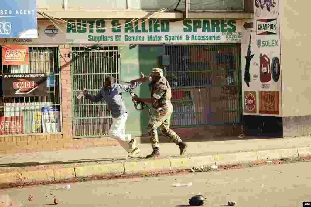 A Zimbabwean soldier beats a man in a street of Harare as protests erupted over alleged fraud in the country's election.