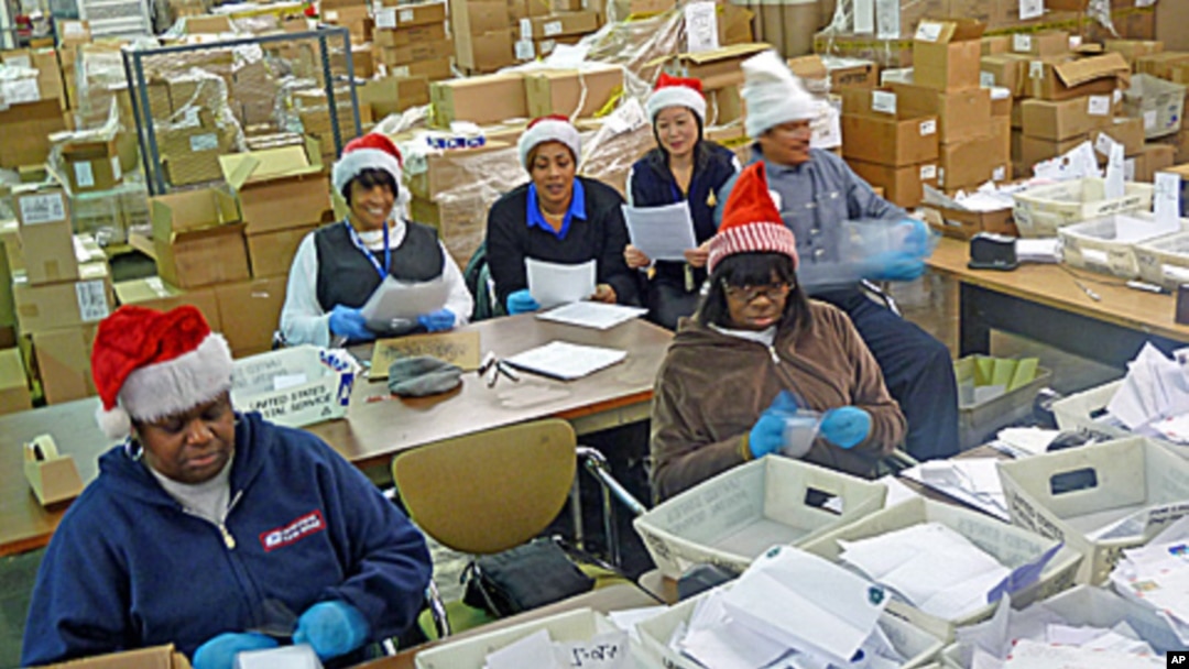 Some of the 22 postal "elves" who volunteer to organize letters to Santa and arrange for the public or charities to "adopt" them.