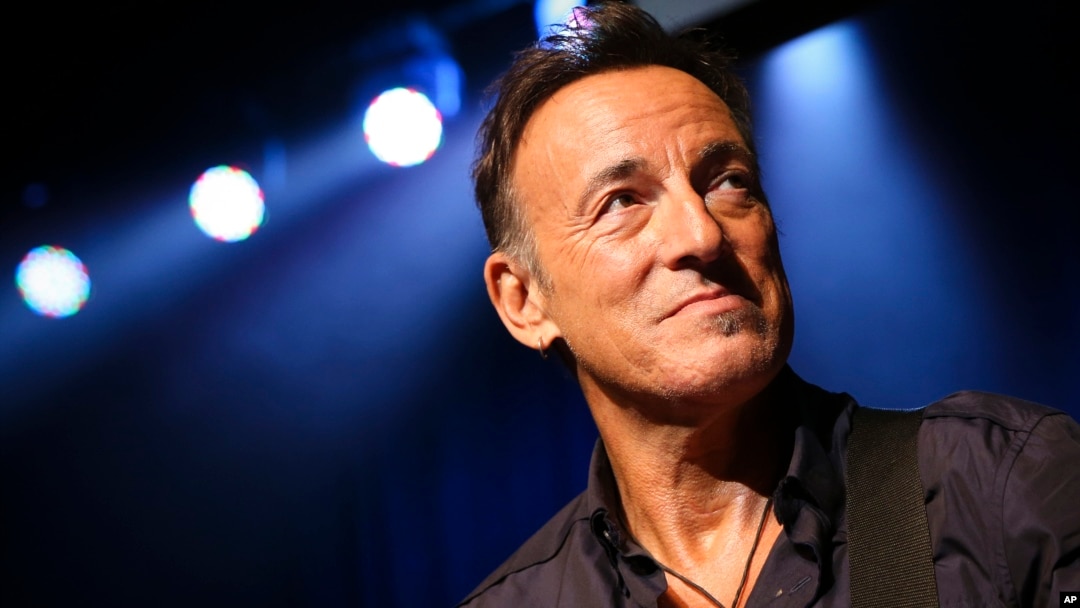 Musician Bruce Springsteen stands on stage at the Stand Up for Heroes event at Madison Square Garden, Nov. 7, 2013, in New York.