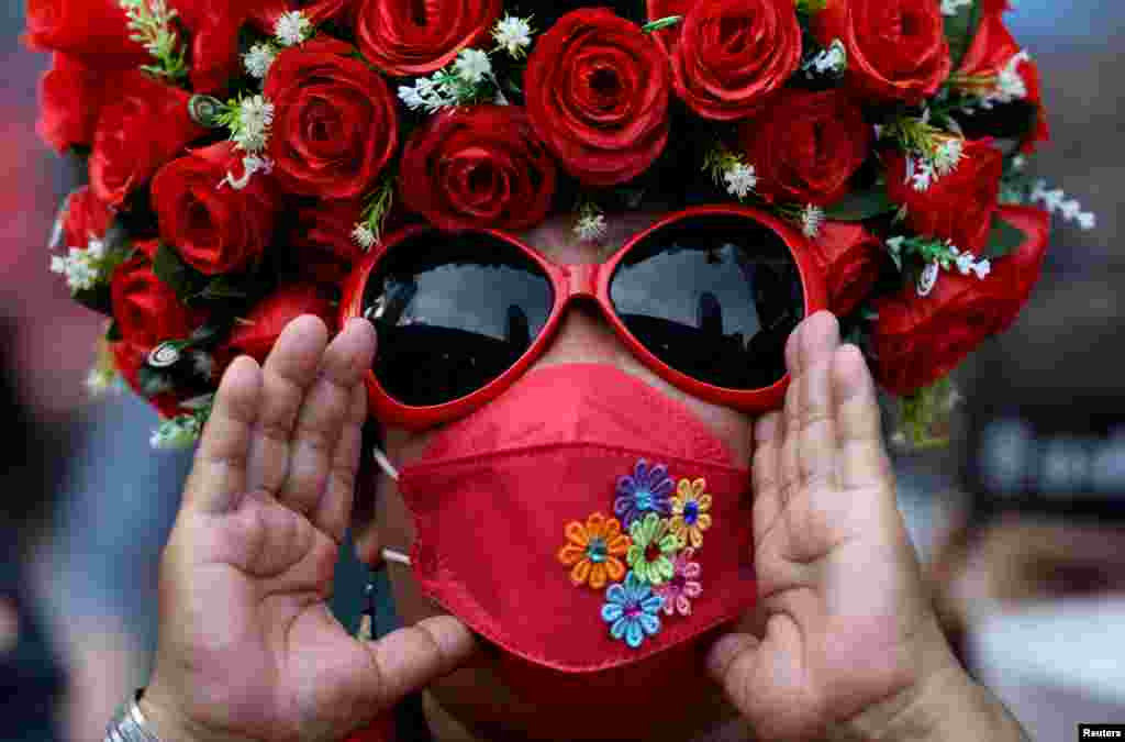 A person participates in a protest over Thai government's handling of the COVID-19 pandemic and to demand Prime Minister Prayuth Chan-ocha's resignation, in Bangkok.