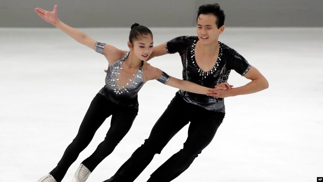 FILE - Ryom Tae Ok and Kim Ju Sik of North Korea compete during the pairs short program at the Figure Skating-ISU Challenger Series in Oberstdorf, Germany, Sept. 28, 2017. 