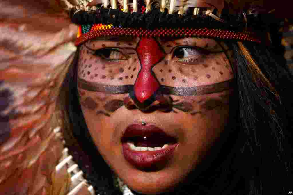 An Indigenous woman attends a march to protest the policies of Brazilian President Jair Bolsonaro and in favor of women's rights and the demarcation of Indigenous lands in Brasilia, Brazil.