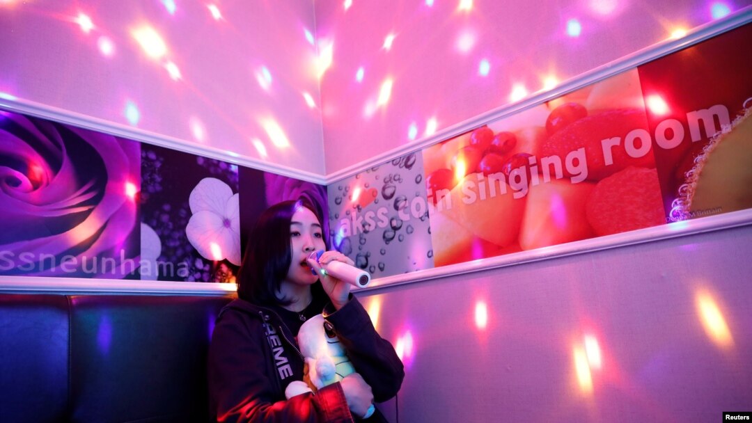 Japanese Yuuka Hasumi, 17, who wants to become a K-pop star, sings a song as she spends time after class, in the Hongdae area of Seoul, South Korea, April 3, 2019. 
